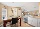 Modern kitchen with granite countertops, stainless steel appliances, and a breakfast nook at 1420 Meadows Pond Dr, Bartow, FL 33830