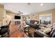 Open living room with hardwood floors, comfortable seating, and bright, natural light at 1420 Meadows Pond Dr, Bartow, FL 33830