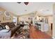 Inviting living room boasting hardwood floors, open concept layout, and modern design at 1420 Meadows Pond Dr, Bartow, FL 33830