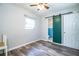 Bedroom featuring wood-look floors, closet and ensuite bathroom at 1604 Park Dr, Lakeland, FL 33803