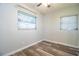 This bedroom has updated flooring, neutral colored walls and two windows to allow for plenty of natural light at 1604 Park Dr, Lakeland, FL 33803