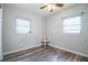 This bedroom has updated flooring, neutral colored walls and two windows to allow for plenty of natural light at 1604 Park Dr, Lakeland, FL 33803