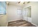 This bedroom has updated flooring, two windows, and closet with mirrored sliding doors at 1604 Park Dr, Lakeland, FL 33803