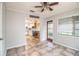 Inviting dining area with tile floors, ceiling fan, and views of the kitchen at 1604 Park Dr, Lakeland, FL 33803