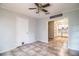 Open dining room space with tile flooring, ceiling fan, and view of adjacent kitchen at 1604 Park Dr, Lakeland, FL 33803