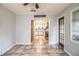 Open dining area with tile flooring looking into the kitchen at 1604 Park Dr, Lakeland, FL 33803