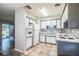 Efficient kitchen with white appliances and charming tiled backsplash at 1604 Park Dr, Lakeland, FL 33803