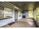 Rear screened porch with durable flooring, ample light, and backyard access at 1604 Park Dr, Lakeland, FL 33803