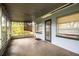 Back porch, fully screened, offering peaceful outdoor space with view to yard at 1604 Park Dr, Lakeland, FL 33803