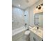 Stylish bathroom featuring marble wall tile, a sleek sink, and black hardware at 1683 Sw 3Rd St, Ocala, FL 34471