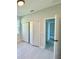 A bedroom with a door to the hallway and a large closet at 1683 Sw 3Rd St, Ocala, FL 34471