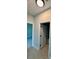 Hallway with neutral walls and white doors at 1683 Sw 3Rd St, Ocala, FL 34471