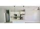 Modern kitchen featuring sleek white cabinets and a center island at 1683 Sw 3Rd St, Ocala, FL 34471