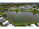 Scenic aerial view of the community featuring a central lake with a fountain and surrounding homes at 1811 Sherwood Hill Dr, Lakeland, FL 33810