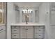 Bathroom with a vanity that has black hardware and a large mirror with lighting at 1811 Sherwood Hill Dr, Lakeland, FL 33810