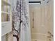 Charming bathtub/shower combo with decorative shower curtain at 1811 Sherwood Hill Dr, Lakeland, FL 33810