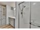 Updated bathroom with a shower, vanity, and wood-look flooring at 1811 Sherwood Hill Dr, Lakeland, FL 33810
