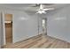 Bright bedroom with wood-look floors and view of closet and bathroom at 1811 Sherwood Hill Dr, Lakeland, FL 33810