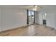 Bright bedroom with wood-look floors, ceiling fan and view of yard at 1811 Sherwood Hill Dr, Lakeland, FL 33810