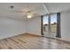 Bright bedroom with wood-look floors, ceiling fan, and large windows at 1811 Sherwood Hill Dr, Lakeland, FL 33810
