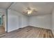 Bright bedroom with wood-look floors and ceiling fan at 1811 Sherwood Hill Dr, Lakeland, FL 33810