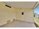 Bright carport featuring an exterior access door and vinyl siding at 1811 Sherwood Hill Dr, Lakeland, FL 33810