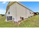 Exterior of the home featuring the siding, windows, and grassy yard at 1811 Sherwood Hill Dr, Lakeland, FL 33810