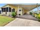 Welcoming home with a carport and a convenient ramp for easy access at 1811 Sherwood Hill Dr, Lakeland, FL 33810