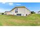 Exterior view of the home featuring well maintained lawn and HVAC system at 1811 Sherwood Hill Dr, Lakeland, FL 33810
