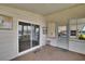 Enclosed Florida room with carpet flooring and a sliding glass door at 1811 Sherwood Hill Dr, Lakeland, FL 33810