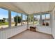 Enclosed carpeted sunroom with multiple windows and plenty of light at 1811 Sherwood Hill Dr, Lakeland, FL 33810