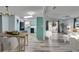 Bright, open floor plan with modern, light-toned wood flooring, seamlessly connects the dining, kitchen, and living area at 1811 Sherwood Hill Dr, Lakeland, FL 33810