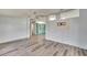 Living room area with vinyl plank flooring and a view into the dining area at 1811 Sherwood Hill Dr, Lakeland, FL 33810