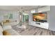 The living room showcases neutral decor, stylish furniture, and a large television for entertainment at 1811 Sherwood Hill Dr, Lakeland, FL 33810