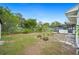 View of backyard with large bushes and small plants for landscape at 1830 Casco, Lakeland, FL 33801
