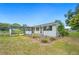 Backyard view of the house, landscape, patio, and big yard at 1830 Casco, Lakeland, FL 33801