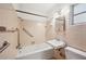 Classic bathroom with a tub, shower, sink, toilet, and peach tile at 1830 Casco, Lakeland, FL 33801