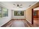 Inviting bedroom with brick accent wall, and large windows overlooking a lush backyard at 1830 Casco, Lakeland, FL 33801