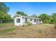 Side of house with big yard and basic landscape for personalization at 1830 Casco, Lakeland, FL 33801