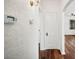 Hallway with wood floors, textured walls, and elegant accents leading to other rooms in the home at 1830 Casco, Lakeland, FL 33801