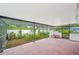 Outdoor patio area, partially covered and enclosed with a garden at 1830 Casco, Lakeland, FL 33801