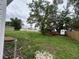 Large backyard with lots of storage space with sheds and mature trees at 1938 Lavon St, Lakeland, FL 33805