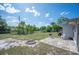 Spacious backyard with a fire pit, a patio area, and plenty of room to enjoy outdoor activities at 1948 Oakland Park Dr, Lake Wales, FL 33898