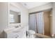 Cozy bathroom featuring a shower-tub combination, a white vanity with a matching mirror, and neutral-toned tile at 1948 Oakland Park Dr, Lake Wales, FL 33898
