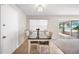 Cozy dining area featuring tile flooring, a modern table set, and natural light streaming through the window at 1948 Oakland Park Dr, Lake Wales, FL 33898