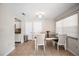 Bright dining area with tiled floors, a modern table set, and access to kitchen and living room areas at 1948 Oakland Park Dr, Lake Wales, FL 33898