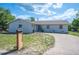 Charming single-story home with a well-maintained lawn and a curved driveway leading to the front entrance at 1948 Oakland Park Dr, Lake Wales, FL 33898