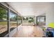Enclosed porch featuring tile flooring, plenty of natural light, and views of the backyard at 1948 Oakland Park Dr, Lake Wales, FL 33898