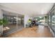 Enclosed porch showcasing tile flooring, access to the backyard, and sliding glass door to the interior at 1948 Oakland Park Dr, Lake Wales, FL 33898