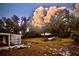 Large backyard with storage shed and mature shade trees at 200 Spurlock Rd, Frostproof, FL 33843